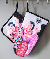 “After Third Prosecco” pot holder by Katrin Valgemäe displayed in a kitchen setting, blending practicality with artistic charm
