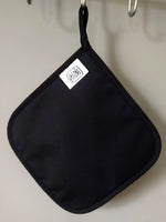 Back side of the “After Third Prosecco” pot holder, showing the artwork and blended cotton-polyester back