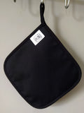 Back side of the “After Third Prosecco” pot holder, showing the artwork and blended cotton-polyester back