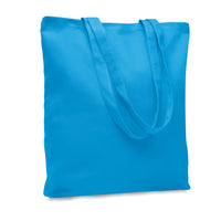Back view of “Bitches and Poodles” canvas shopping bag, highlighting the plain cotton surface and durable construction