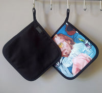 Both sides of the “Pervert in the Kitchen” pot holder, displaying its artistic design on the front and durable cotton-polyester backing