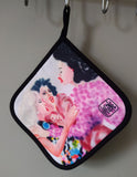 Close-up of “After Third Prosecco” pot holder, showcasing intricate artwork and handmade stitching