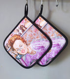 “Kitchen” pot holder by Katrin Valgemäe displayed in a kitchen setting, blending functionality with artistic commentary