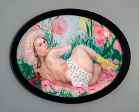 “Once in the 80s” by Katrin Valgemäe, displayed in an elegant black frame, emphasizing its unique oval shape