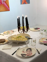 Porcelain plate “Queens of Chaos 1” by Katrin Valgemäe used as elegant tableware, blending art with dining