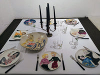 “Queens of Chaos 3” by Katrin Valgemäe featured as elegant tableware, merging sophisticated design with a satirical edge