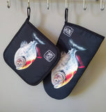 Set of “Carnivore” oven glove and pot holder by Katrin Valgemäe, elegantly displayed and ready for use