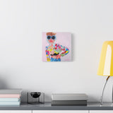 Small “Chick in Moschino” canvas print displayed on a white wall, adding a touch of playful sophistication to the space