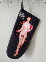 The “Eve” oven glove hanging, combining artistic elegance with practical functionality in the kitchen